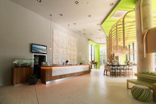 a lobby with a bar and a restaurant at Hotel Gergana in Albena