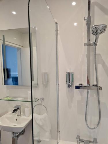 a bathroom with a shower and a sink at Ardshiel Hotel in Campbeltown