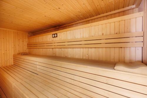 an empty wooden sauna with wooden floors and ceilings at Hotel Eden Nord Soller in Port de Soller