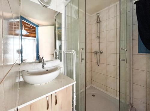 a bathroom with a sink and a shower at Mirabella Camping in Zamárdi