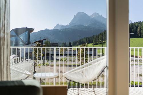 a balcony with a view of a mountain at Ariane's Guesthouse in Sesto