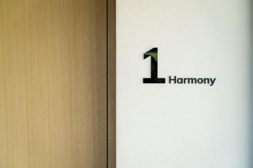 a door with the humanity sign on it at Ariane's Guesthouse in Sesto