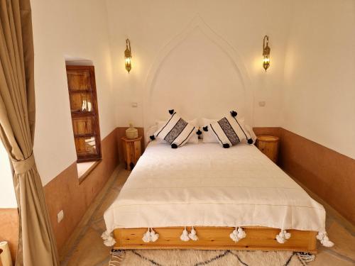 Postel nebo postele na pokoji v ubytování RIAD SAMAH