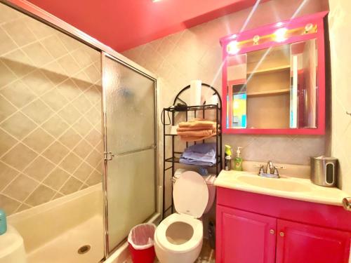 a bathroom with a toilet and a sink and a shower at #4 Travelers -Brooklyn - Private Room & Workspace - Shared Bath By Zen Living Short Term Rental in Brooklyn