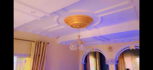a ceiling with a chandelier in a room at Stunning 3-Bedrooms GuestHouse in Limbe Cameroon in Limbe