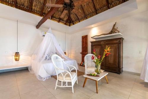 Postel nebo postele na pokoji v ubytování Hotel Coralina Island
