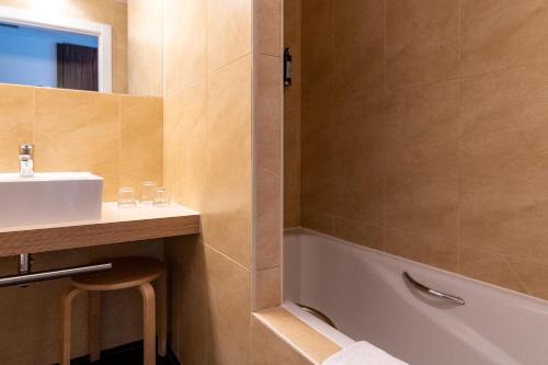 a bathroom with a sink and a bath tub at ETH Rioja in Haro