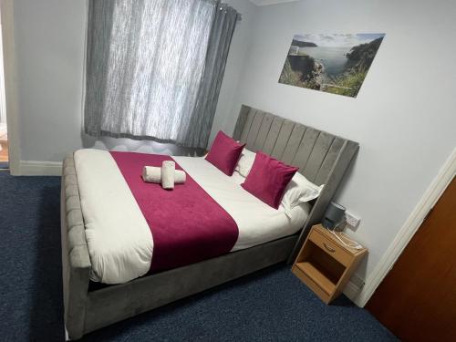 Ένα ή περισσότερα κρεβάτια σε δωμάτιο στο Berry Hotel