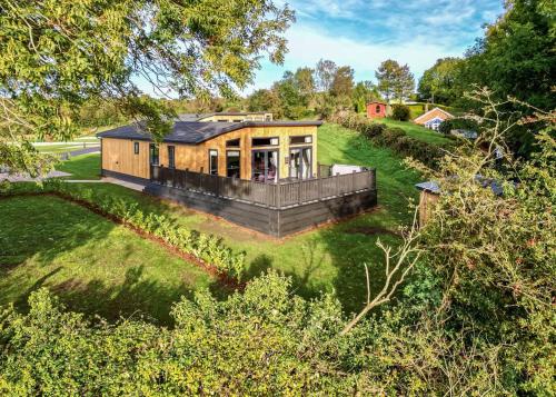 an overhead view of a wooden house on a lawn at Forest Hills Lodges in Coleford