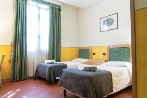 Ένα ή περισσότερα κρεβάτια σε δωμάτιο στο Hotel Panama