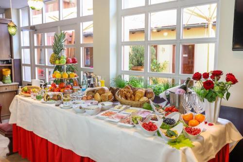a table with a buffet of food on it at Laurentius Boutique-Hotel & Restaurant in Weikersheim