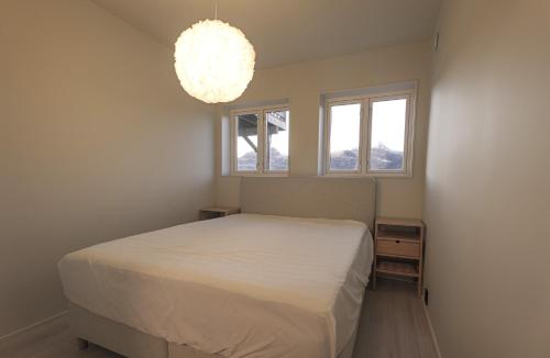 Postel nebo postele na pokoji v ubytování Up-scale apartment in picturesque surroundings
