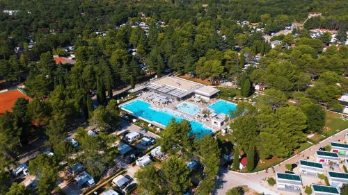 an aerial view of a resort with two swimming pools at Easyatent Camping Valkanela in Vrsar