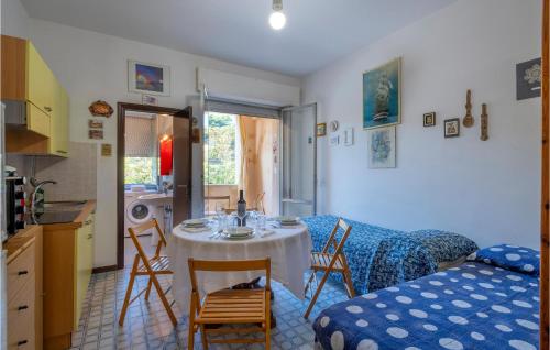 a kitchen with a table and chairs in a room at Awesome Apartment In Ortona With Wifi in Ortona