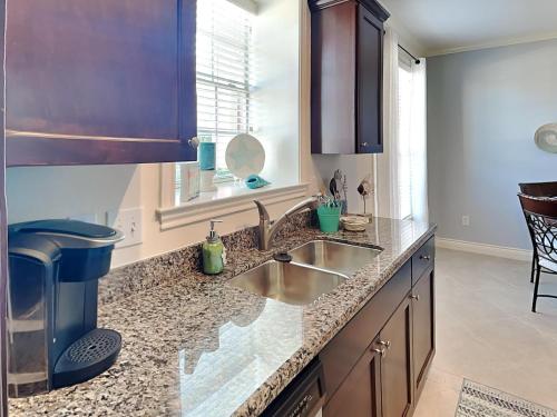 a kitchen with a sink and a counter top at Dawn 315-saltwater Escape in Galveston