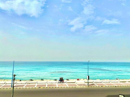 a view of the beach and the ocean at Salvatore Rooms -Corneish Street in Alexandria