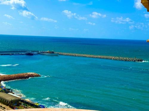 an aerial view of the ocean with a pier at Salvatore Rooms -Corneish Street in Alexandria