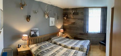 a bedroom with a bed and a window in it at Steinadler Seekareck FL - Skiing Holiday in Obertauern in Obertauern
