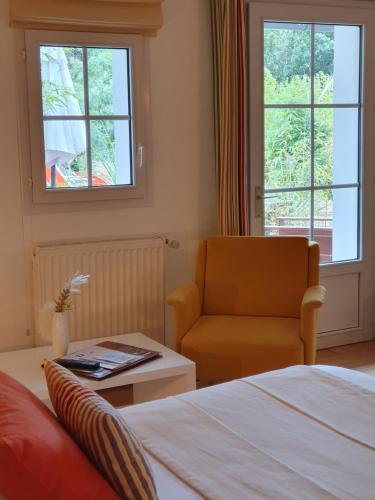 Postel nebo postele na pokoji v ubytování Hôtel Les Prateaux
