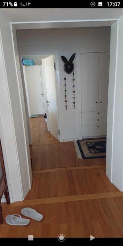 a hallway with a room with a ceiling fan at שרון על המים in Herzliya B