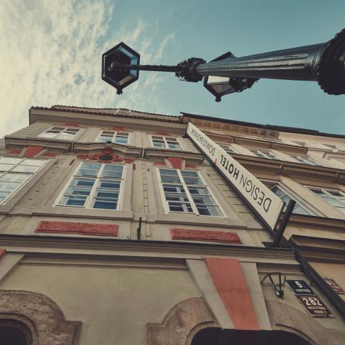 a street sign in front of a building at Domus Balthasar Boutique Hotel in Prague