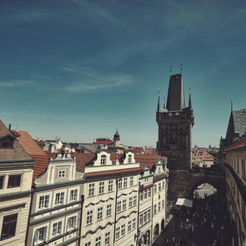 a view of a city with a building and a clock tower at Domus Balthasar Boutique Hotel in Prague