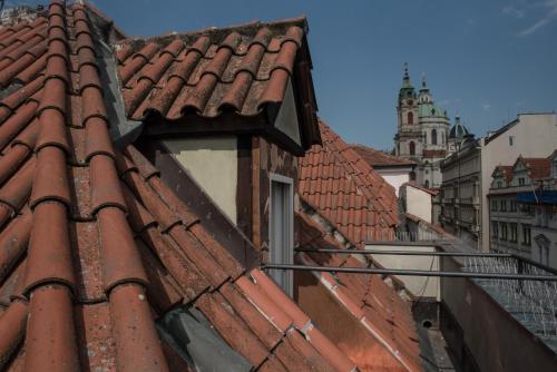 a red roof with a window on a building at Domus Balthasar Boutique Hotel in Prague