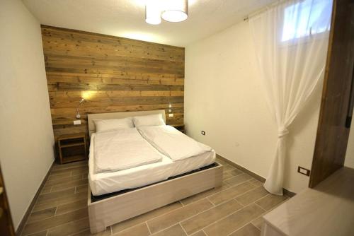 Giường trong phòng chung tại Taverna al ponte