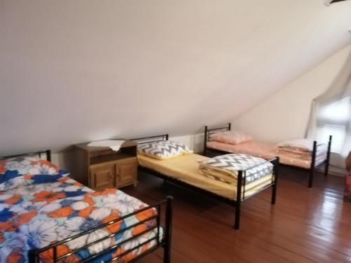 Ένα ή περισσότερα κρεβάτια σε δωμάτιο στο Ewa Dom