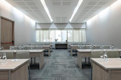 a large dining room with tables and chairs at Hotel York Luxury Suites Medellin by Preferred in Medellín