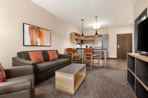 a living room with a couch and a table at Candlewood Suites Murfreesboro by IHG in Murfreesboro