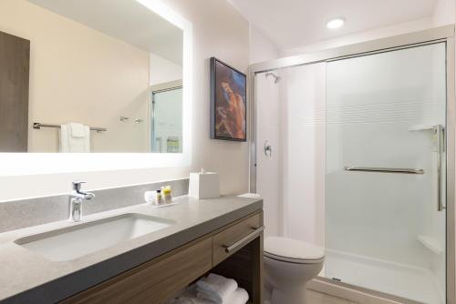 a bathroom with a sink and a shower at Candlewood Suites Murfreesboro, an IHG Hotel in Murfreesboro