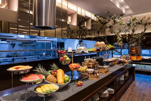 a buffet line with many different types of food at Hotel 93 Luxury Suites by Preferred in Bogotá