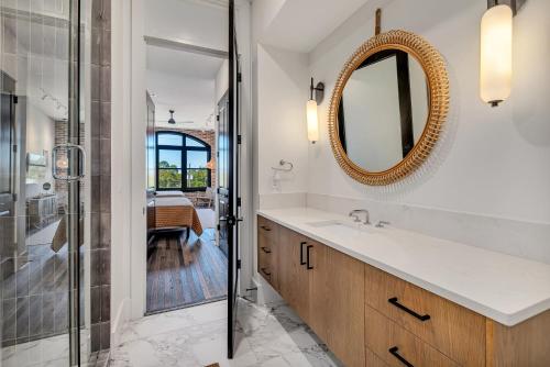 a bathroom with a sink and a mirror at Benz View Penthouse W Rooftop, Secure Parking in Atlanta