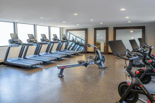 a gym with rows of treadmills and exercise bikes at DoubleTree by Hilton San Bernardino in San Bernardino
