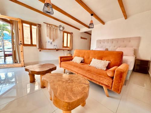 a living room with a couch and a table at Sababa Resort in San Pedro La Laguna