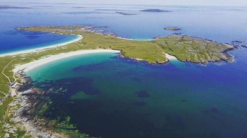 an aerial view of an island in the ocean at Roundstone Quay House in Roundstone