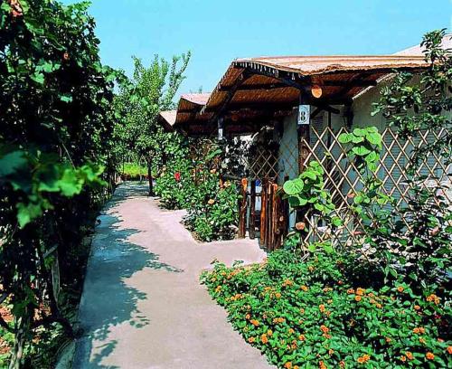 a house with a fence next to a garden at Aparthotel Villa Marinù in Ischia