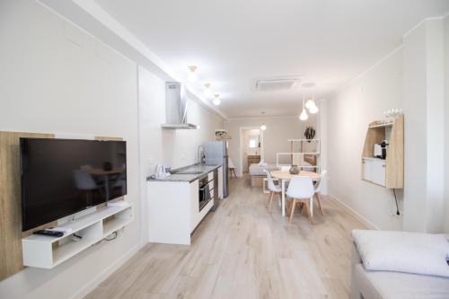 a living room with a kitchen and a dining room at Nautical Flats by Concept in Valencia
