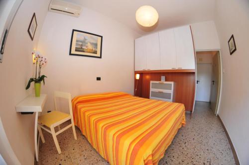 En eller flere senge i et værelse på Hotel Antonella