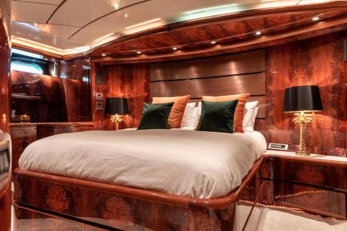 a bedroom with a large bed on a yacht at Super Yacht Located in Puerto Banus in Marbella