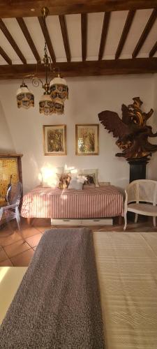 a bedroom with a bed and a table and chairs at La Tana di Ulisse in Borgo a Buggiano