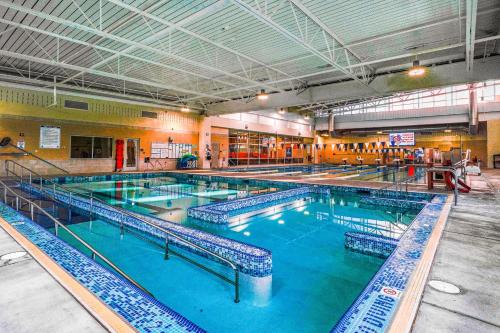 a large indoor swimming pool with blue water at Gleanings Pond in McHenry
