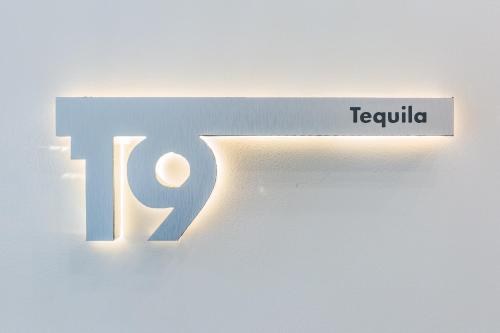 a sign for tequilla on a wall at Casa Castillo in Mexico City