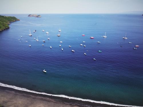 an aerial view of boats in a large body of water at Villa del Sueño in Playa Hermosa