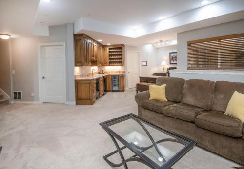 a living room with a couch and a kitchen at Castle Peak Close in Edwards