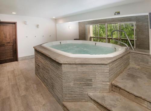 a large bath tub in a room with a window at Fall Ridge in Vail