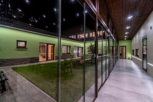 a hallway of a building with a green wall at Winifera Penzion in Pavlov