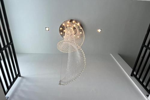 a silver object is hanging on a wall at De Piraya residence in Ban Bo Sai Klang