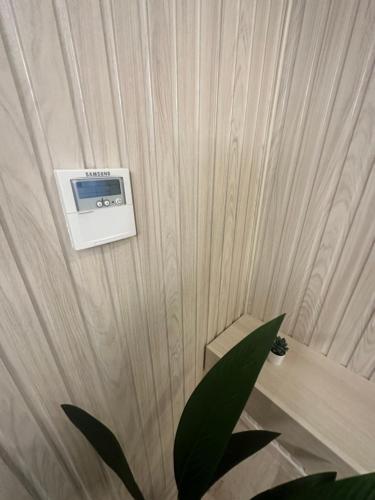 a room with a wall with a microwave on it at bedroom (3) apartment of 200 square meters with an outdoor terrace in Umm Uthainah